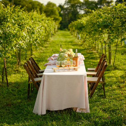 Table RentalsTable and chairs setup outside in a vineyard
