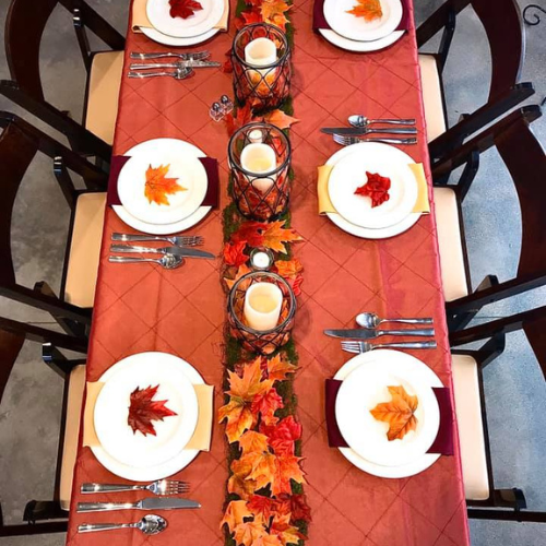 Set table with fall themed decorations