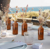 Amber Bottle Vases with Pampas Grass (optional)