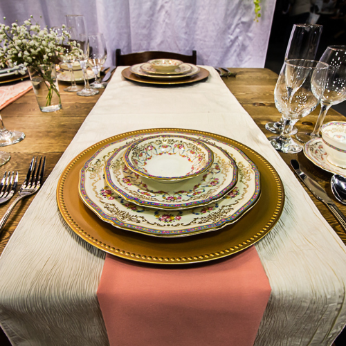 Table set with plate ware and glassware